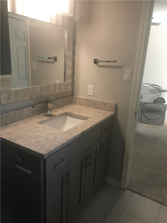 1610 Waterloo Trail, Unit B Austin, TX 78704 - Photo 15 of 23 a bathroom with a sink and a mirror
