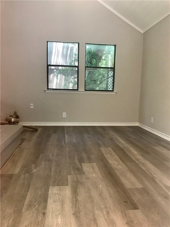 1610 Waterloo Trail, Unit B Austin, TX 78704 - Photo 3 of 23 an empty room with wooden floor and windows