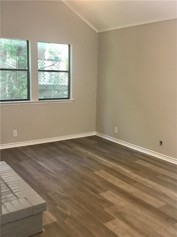 1610 Waterloo Trail, Unit B Austin, TX 78704 - Photo 4 of 23 an empty room with wooden floor and windows