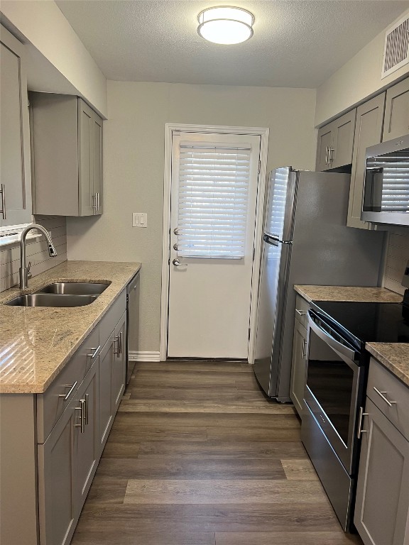 1610 Waterloo Trail, Unit B Austin, TX 78704 - Photo 7 of 23 a kitchen with a sink stove and refrigerator