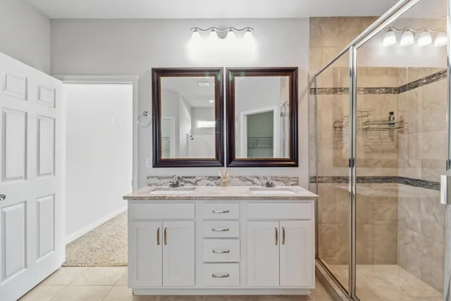a view of an empty room with window and closet area