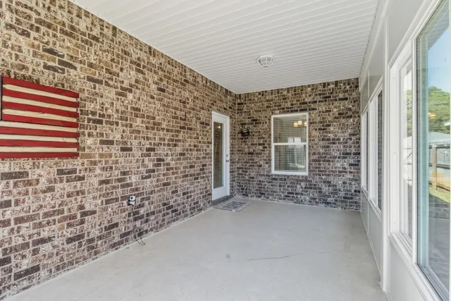 a view of a swimming pool with a yard