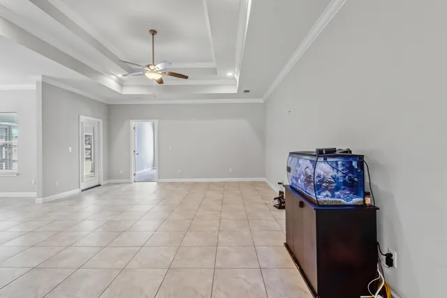 a view of a big room with closet and windows