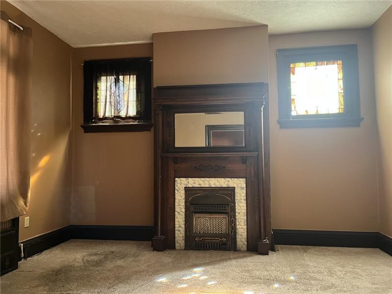 2515 Mt Troy Road Pittsburgh, PA 15212 - Photo 12 of 27 a view of an empty room with a fireplace