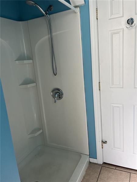 2515 Mt Troy Road Pittsburgh, PA 15212 - Photo 14 of 27 a bathroom with a glass door shower