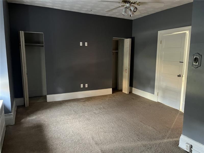 2515 Mt Troy Road Pittsburgh, PA 15212 - Photo 18 of 27 wooden floor and a chandelier fan in a room