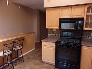 2515 Mt Troy Road Pittsburgh, PA 15212 - Photo 7 of 27 a kitchen with a stove and a microwave