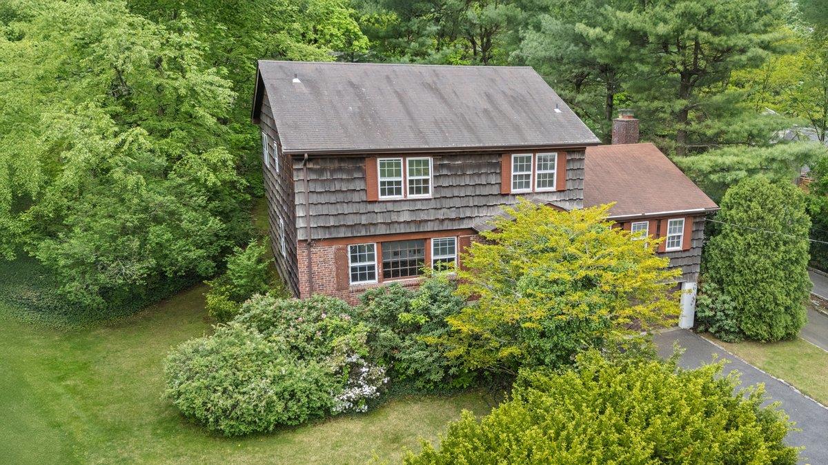 495 Stratton Road New Rochelle, NY 10804 - Photo 1 of 1 an aerial view of a house with a yard and potted plants
