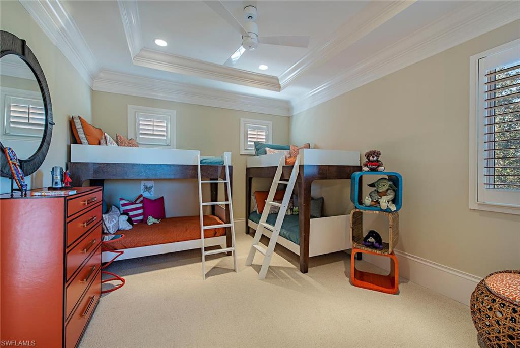 2178 Miramonte Way Naples, FL 34105 - Photo 13 of 21 a bedroom with furniture and a fireplace