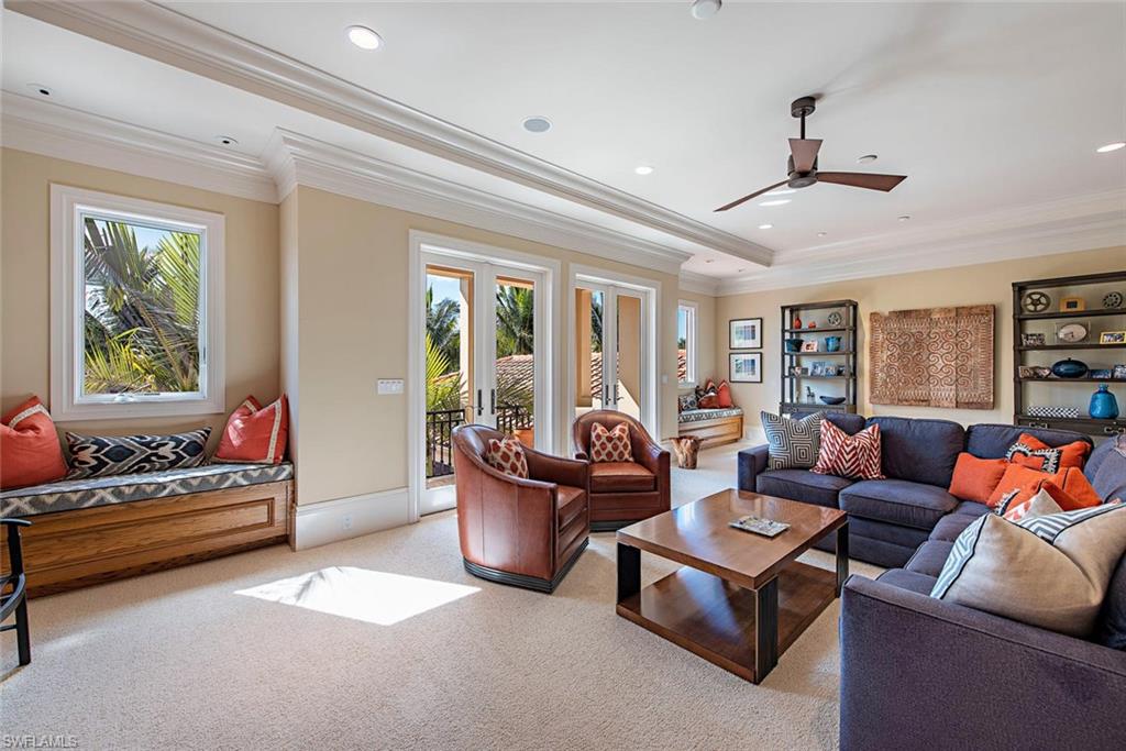 2178 Miramonte Way Naples, FL 34105 - Photo 15 of 21 a living room with furniture and a large window