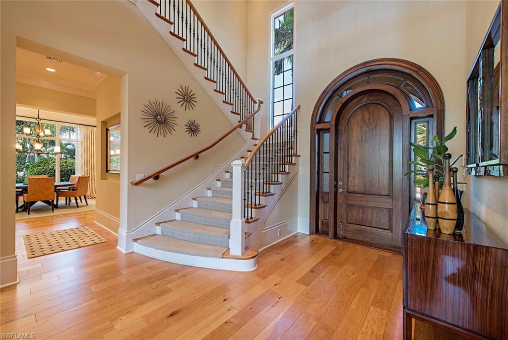 2178 Miramonte Way Naples, FL 34105 - Photo 2 of 21 a view of entryway and hall with wooden floor