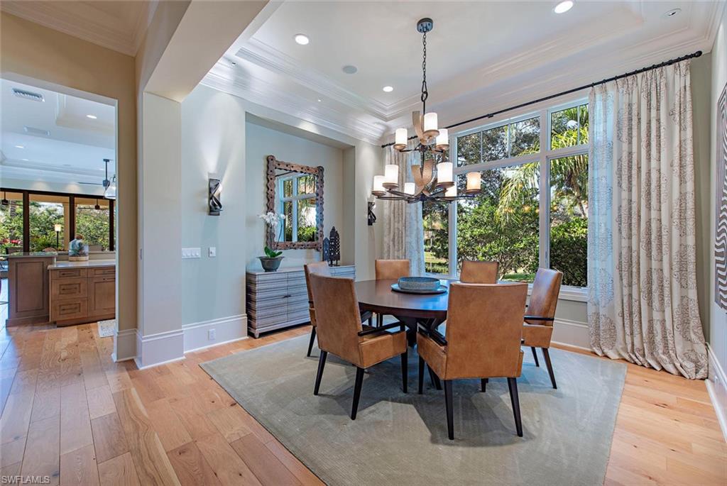 2178 Miramonte Way Naples, FL 34105 - Photo 6 of 21 a view of a dining room with furniture window and wooden floor