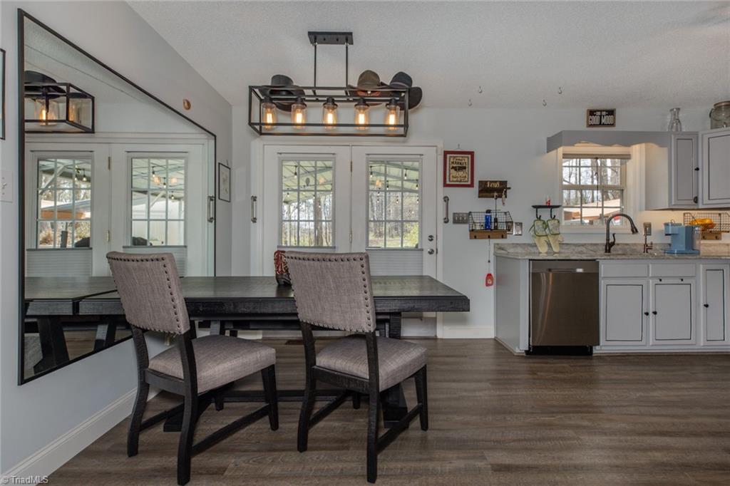 4243 Hunters Run Trinity, NC 27370 - Photo 11 of 33 Eat in kitchen is super spacious accommodating this large table with bench and chairs