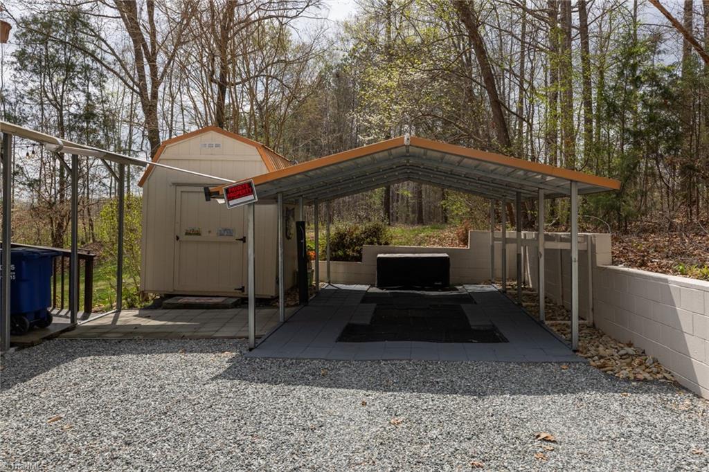 4243 Hunters Run Trinity, NC 27370 - Photo 5 of 33 storage shed and detached carport