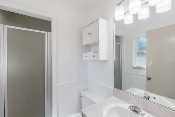 a bathroom with a bathtub and a sink