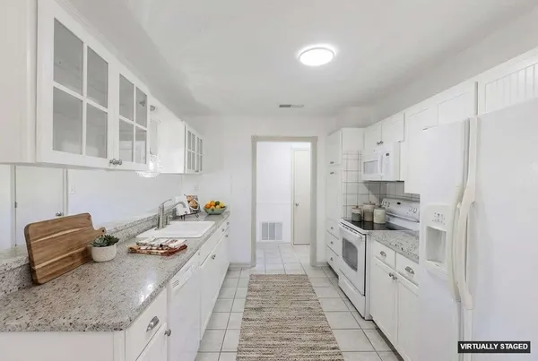 a kitchen with a sink and cabinets