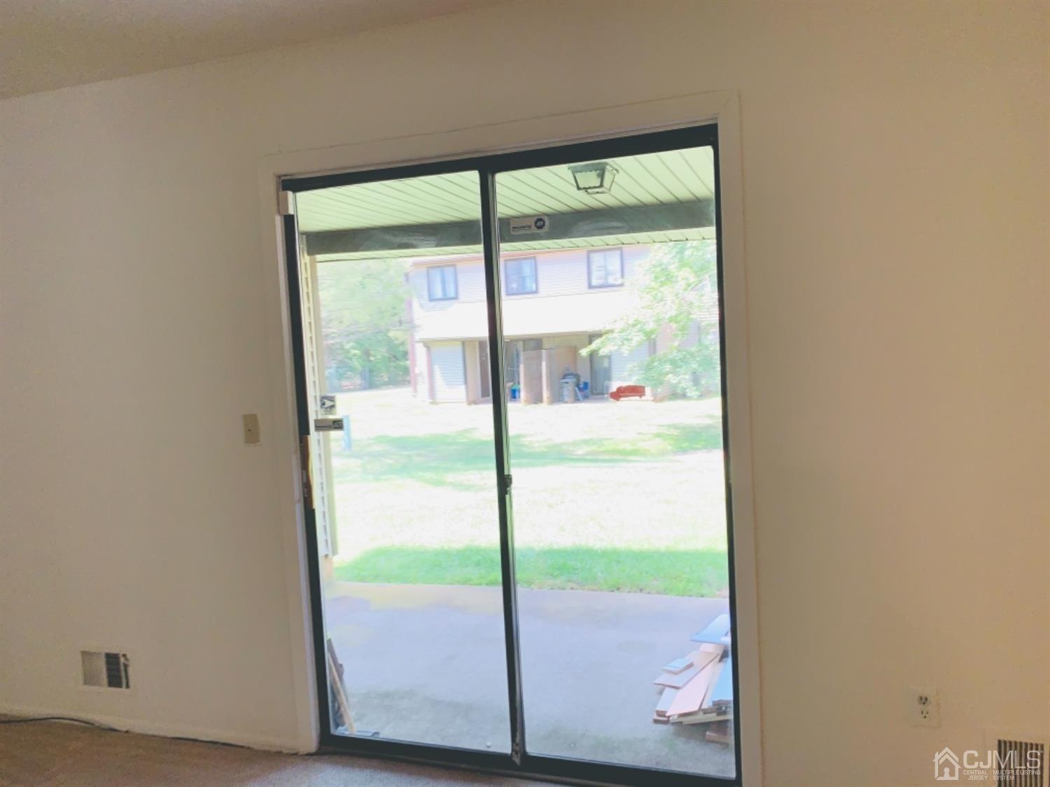 8401 Hana Road Edison, NJ 08817 - Photo 11 of 41 a view of a porch with a door