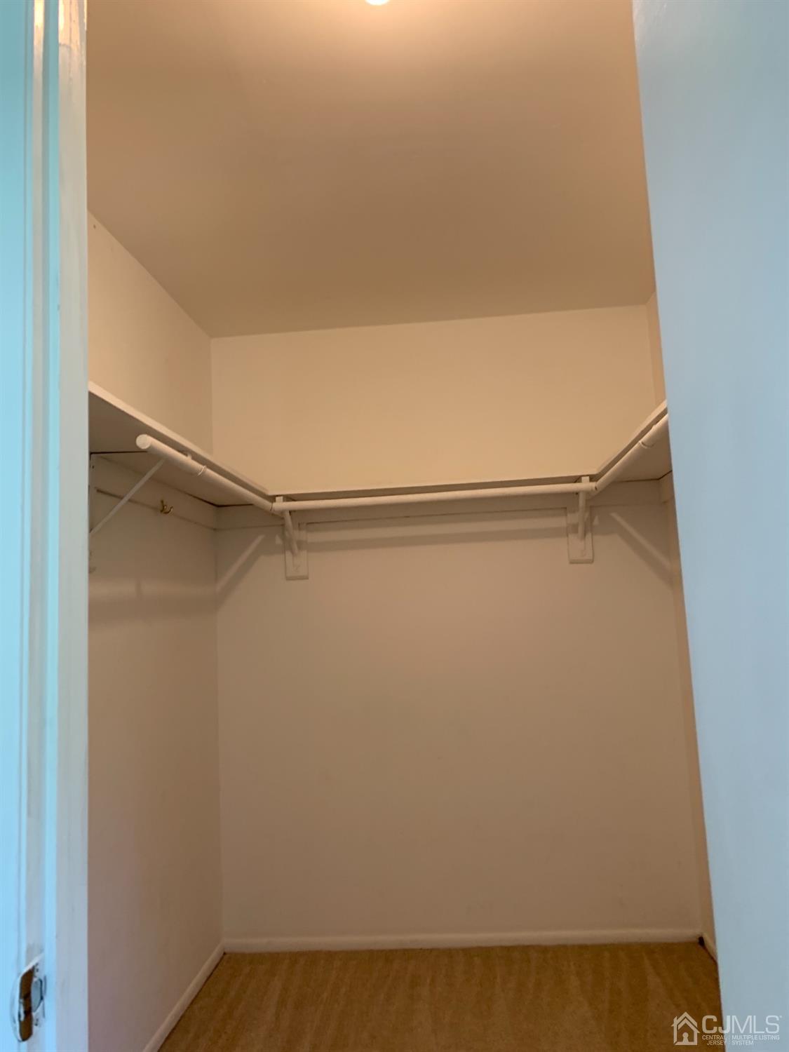 8401 Hana Road Edison, NJ 08817 - Photo 29 of 41 a view of small space with racks on the wall