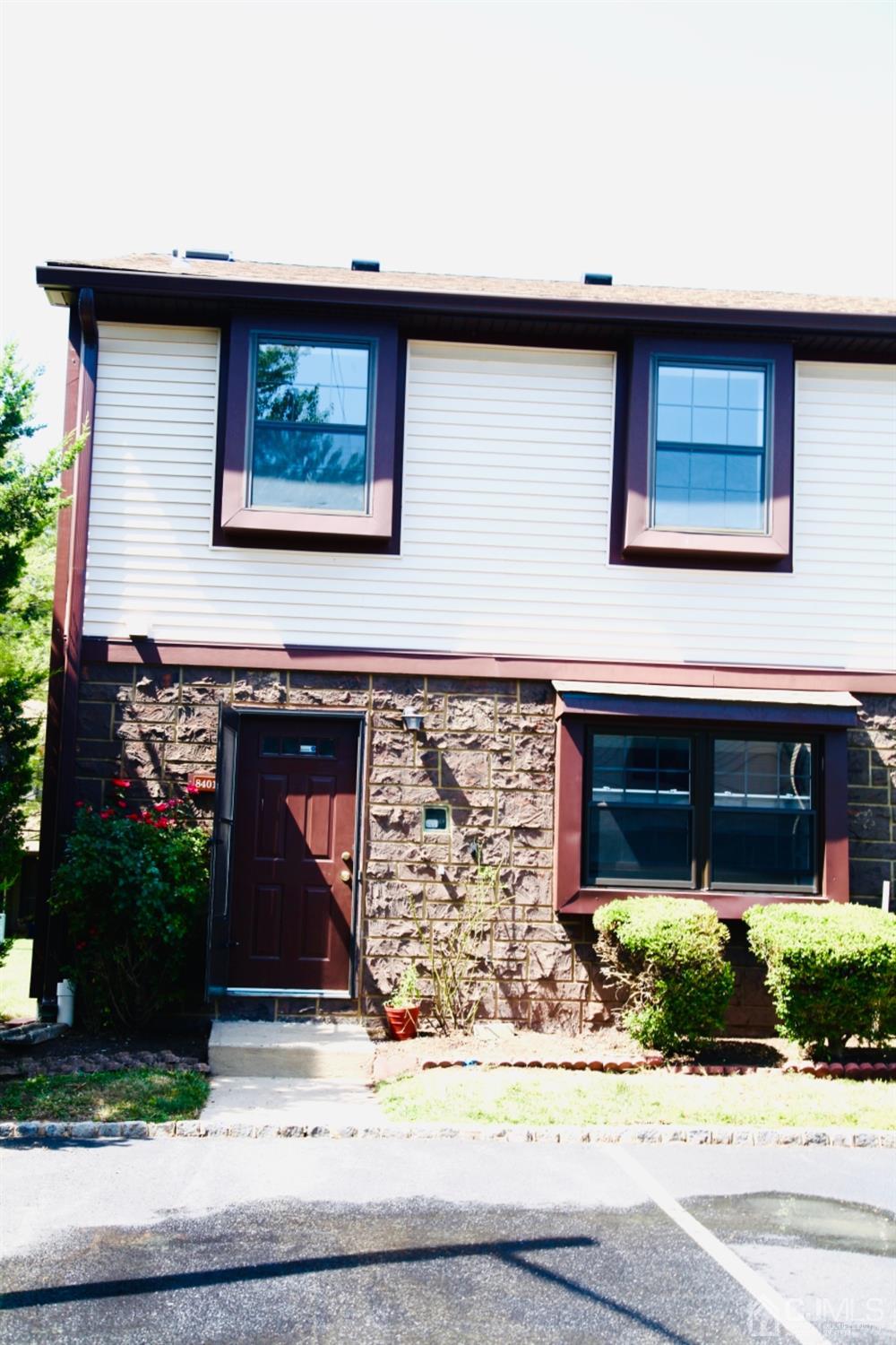 8401 Hana Road Edison, NJ 08817 - Photo 4 of 41 a front view of a house with garage
