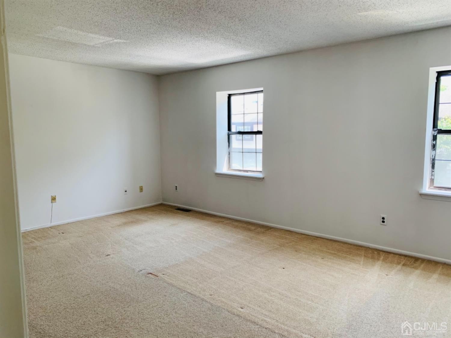 8401 Hana Road Edison, NJ 08817 - Photo 31 of 41 an empty room with windows