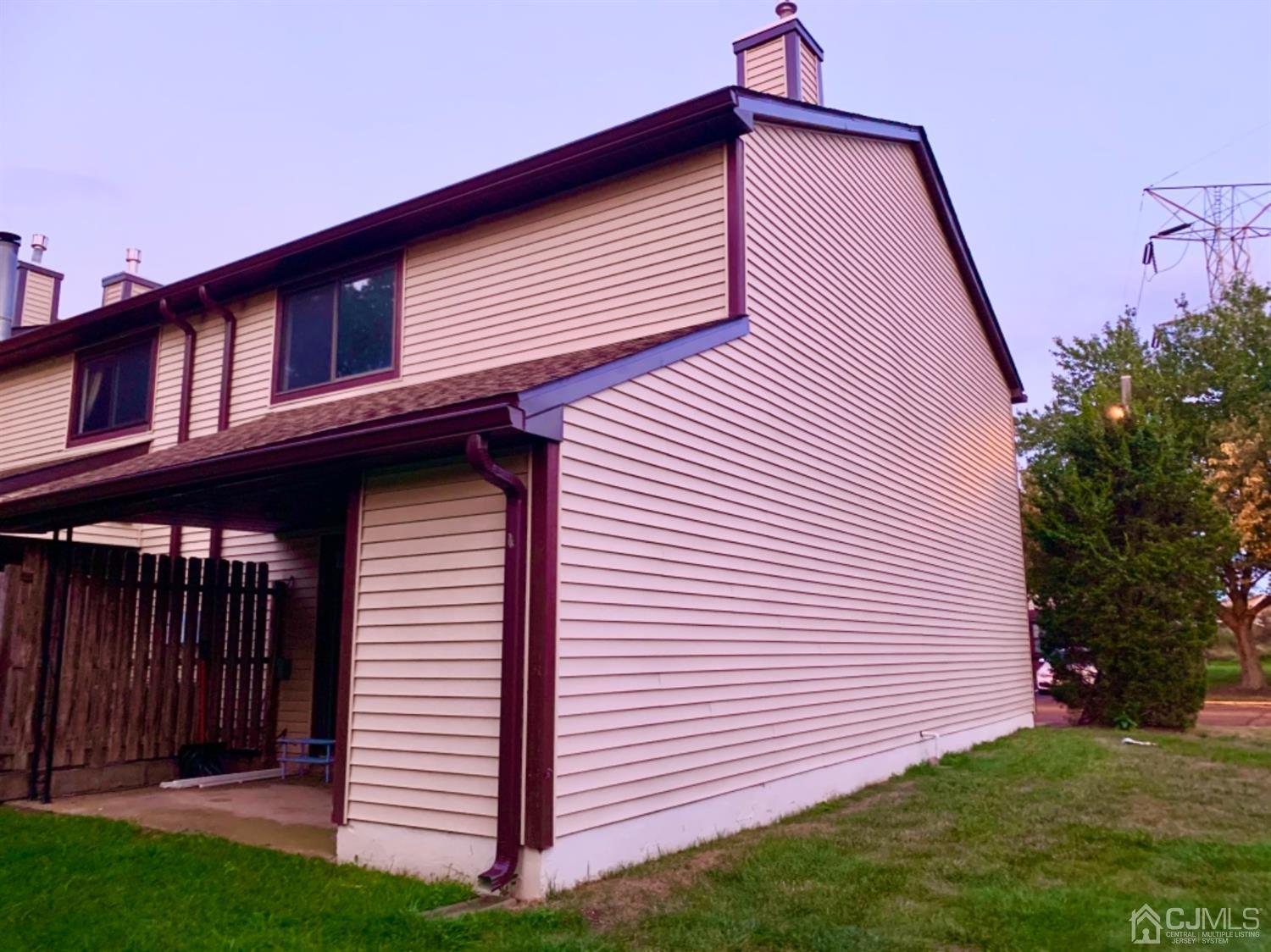 8401 Hana Road Edison, NJ 08817 - Photo 35 of 41 a front view of a house with garden