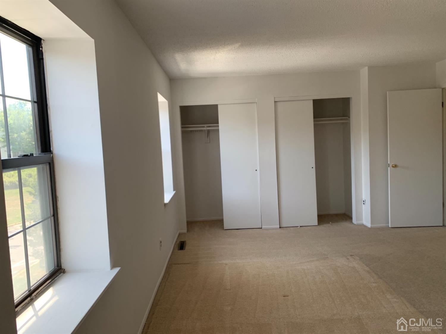 8401 Hana Road Edison, NJ 08817 - Photo 36 of 41 an empty room with windows