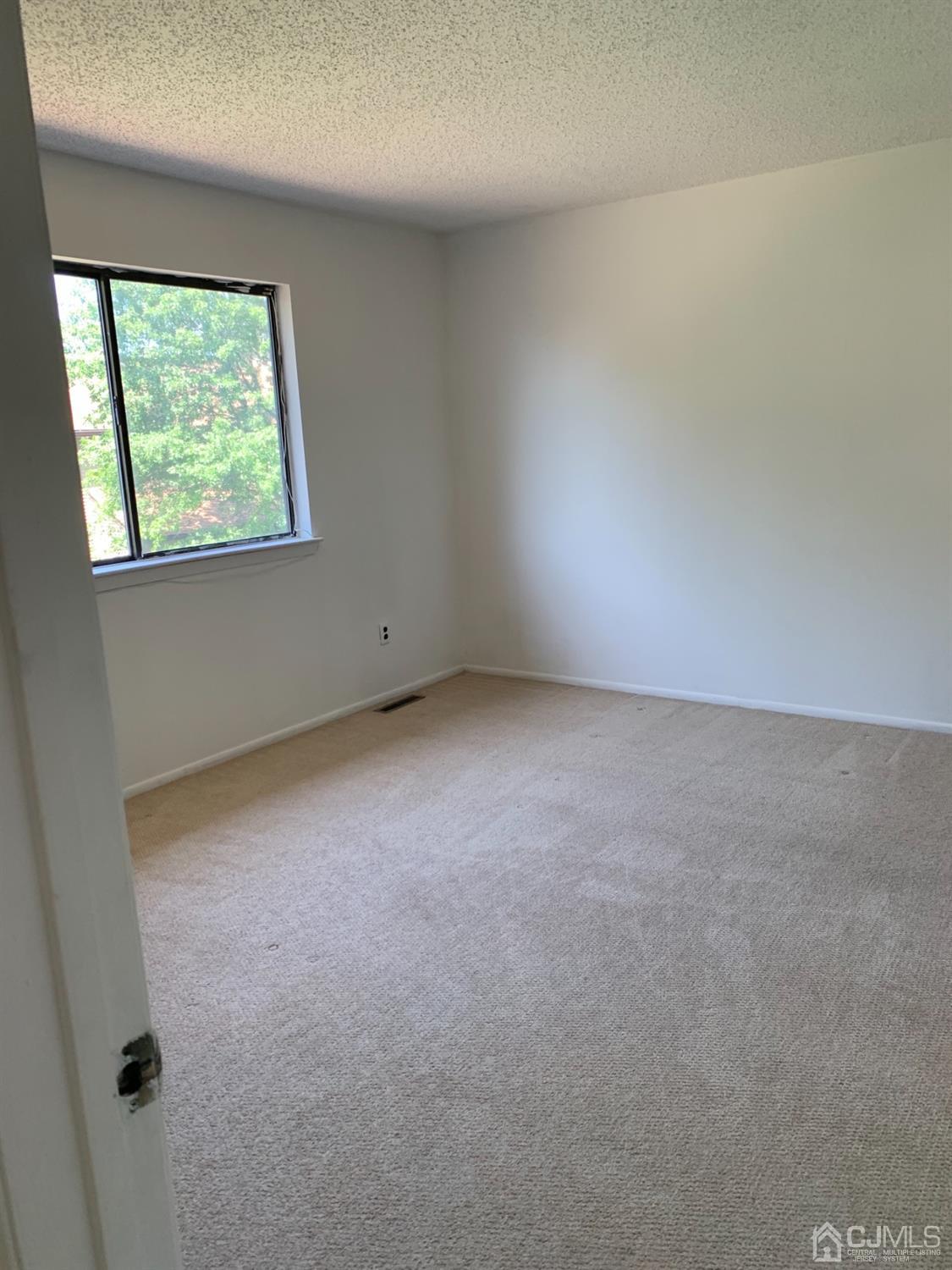 8401 Hana Road Edison, NJ 08817 - Photo 40 of 41 an empty room with a window