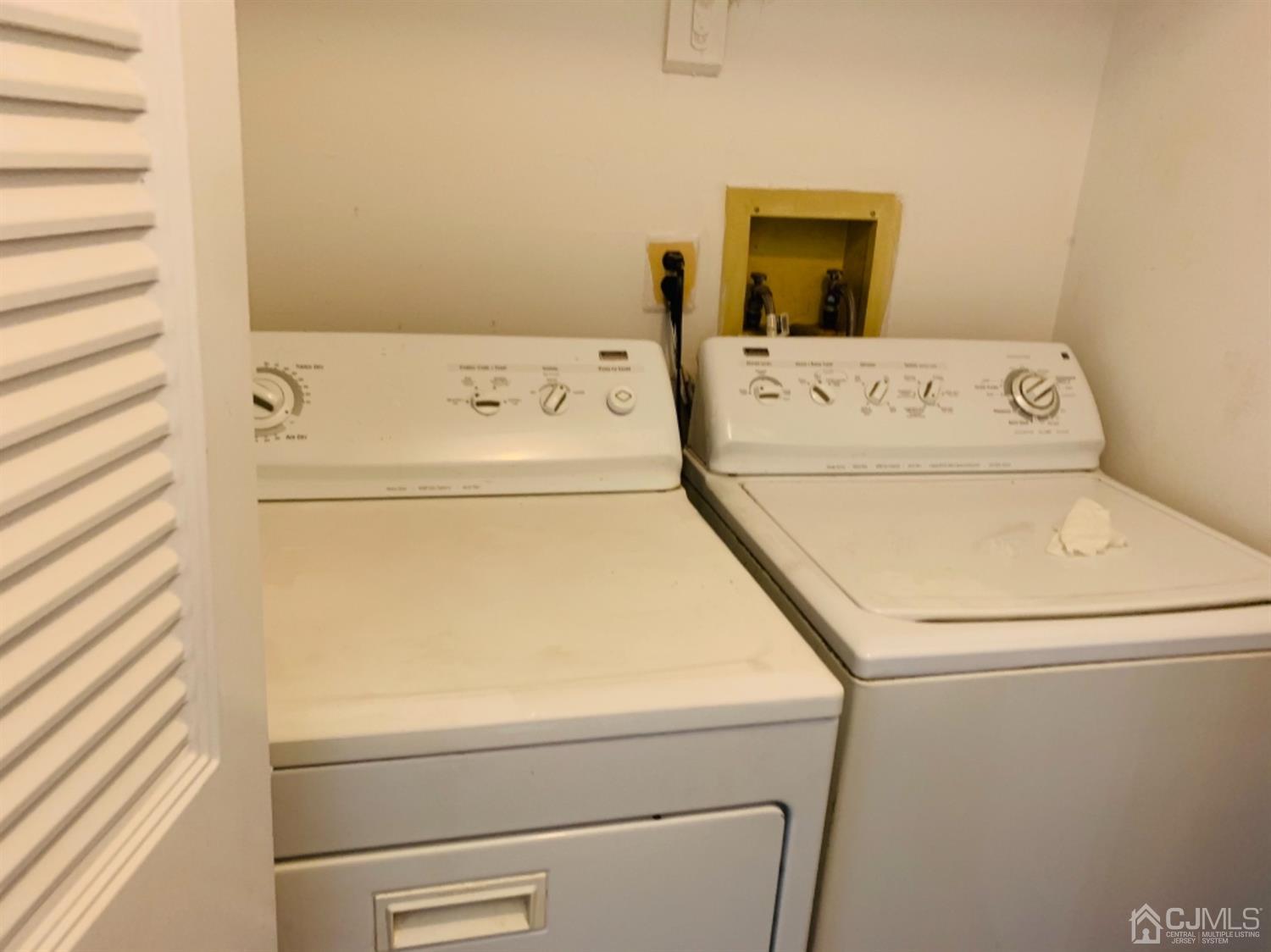 8401 Hana Road Edison, NJ 08817 - Photo 9 of 41 a utility room with dryer and washer