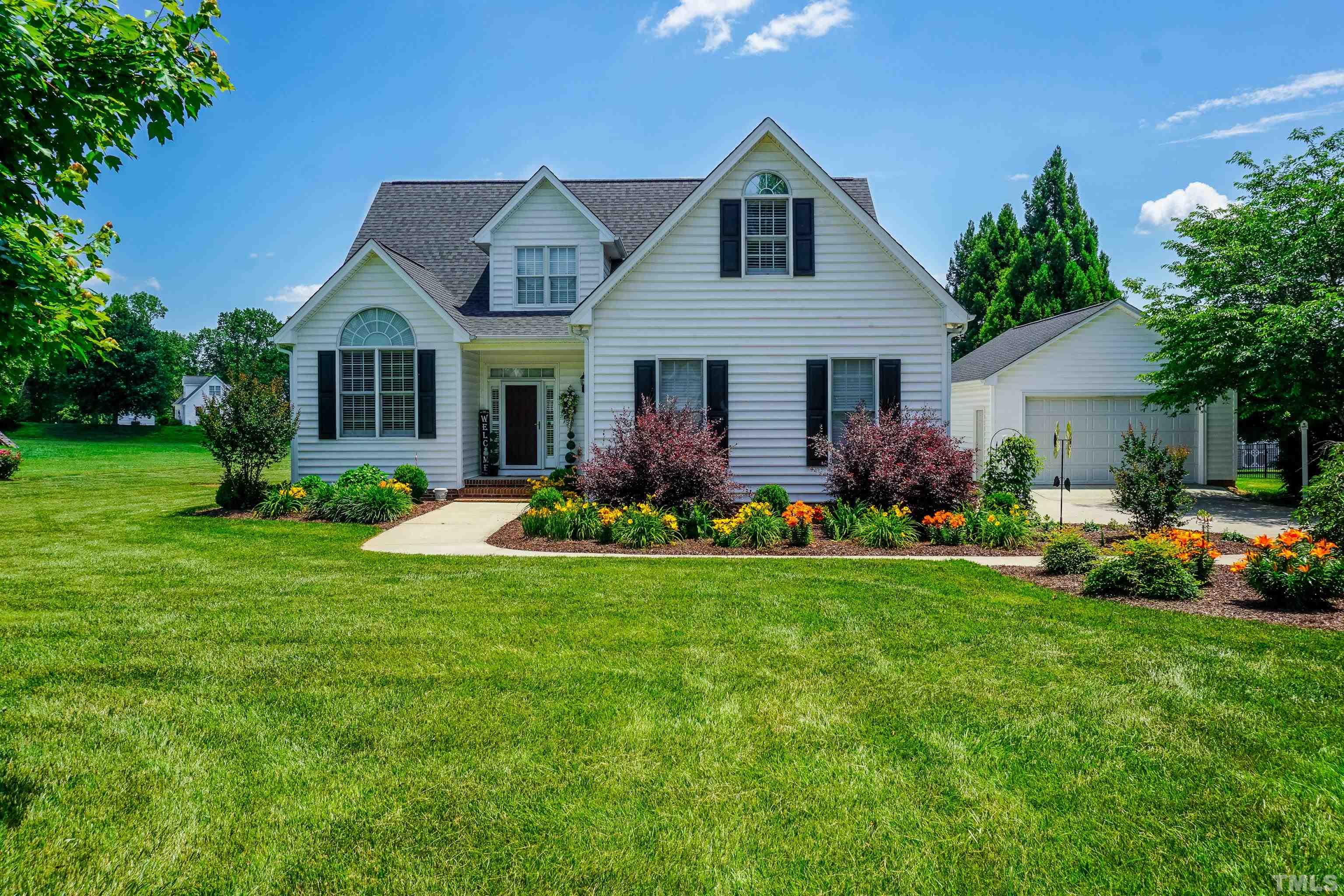 103 Derwin Drive Timberlake, NC 27583 - Photo 1 of 57 a front view of house with yard and green space