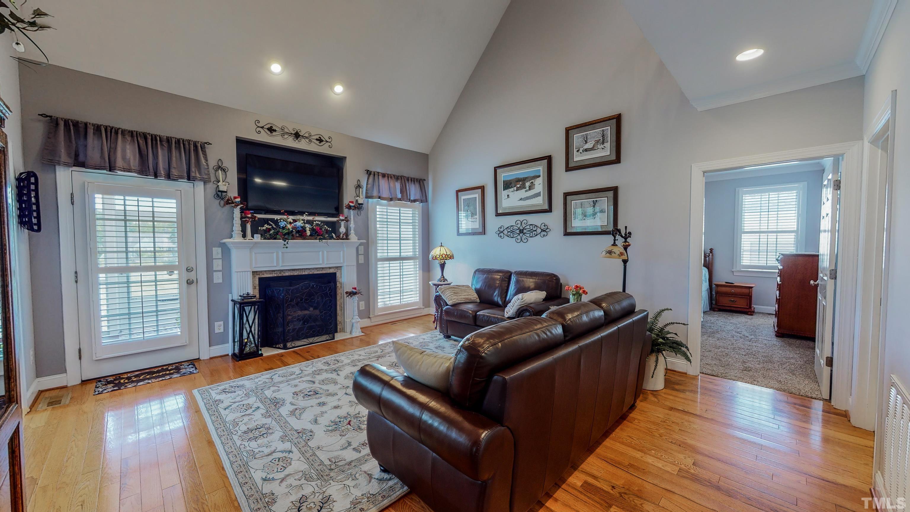 103 Derwin Drive Timberlake, NC 27583 - Photo 11 of 57 a living room with furniture and a fireplace
