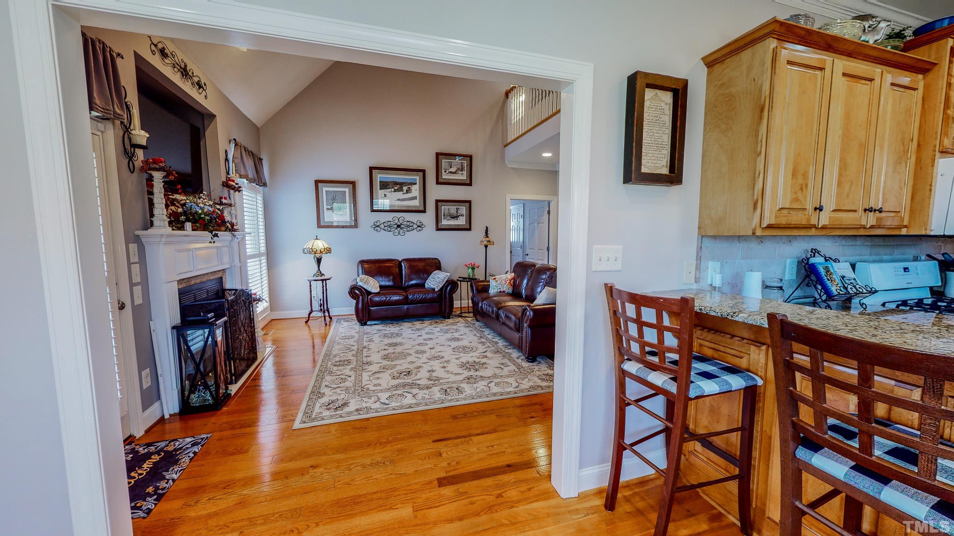 103 Derwin Drive Timberlake, NC 27583 - Photo 16 of 57 a living room with furniture and a wooden floor