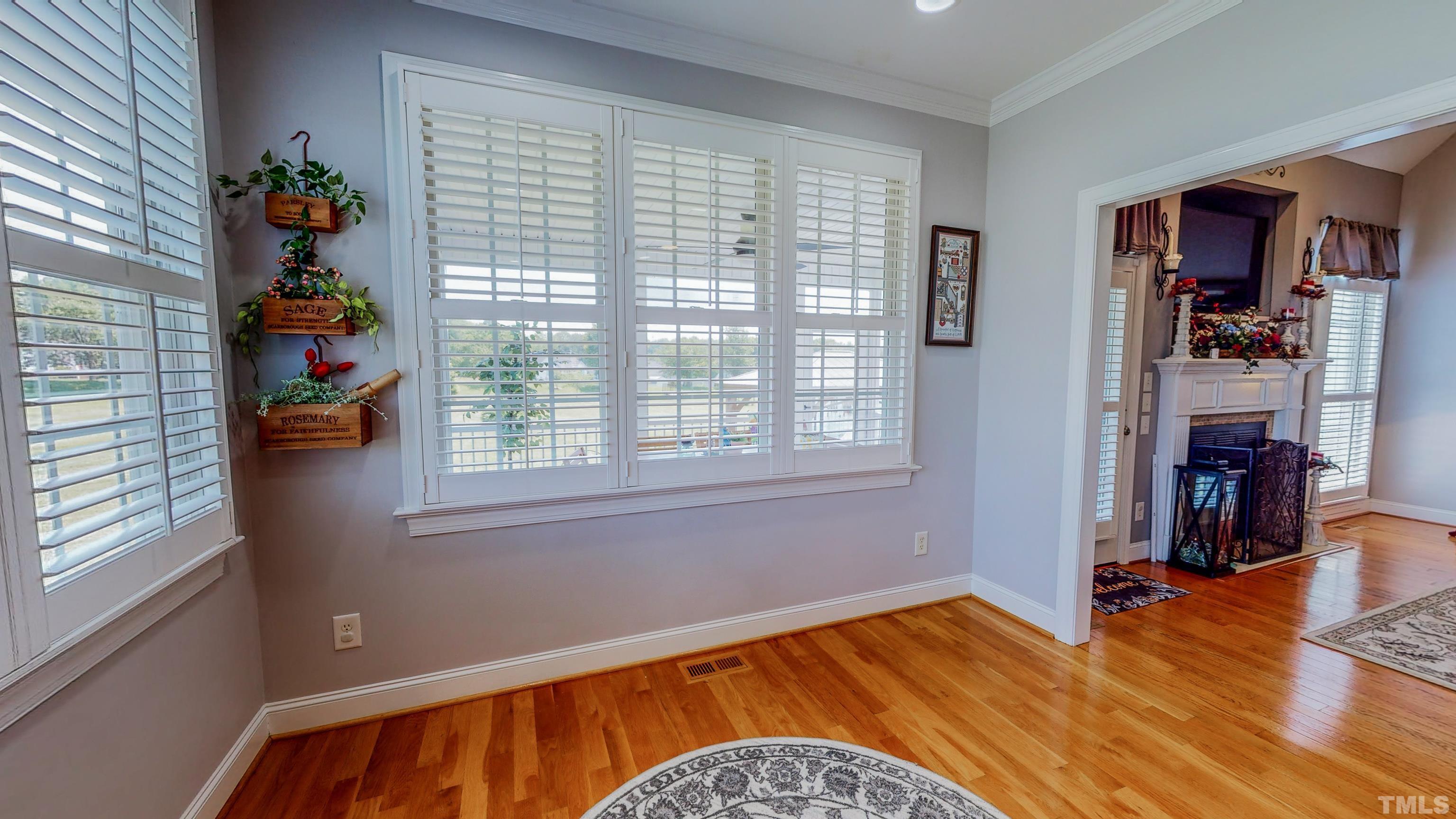 103 Derwin Drive Timberlake, NC 27583 - Photo 17 of 57 a view of an empty room with wooden floor and a window