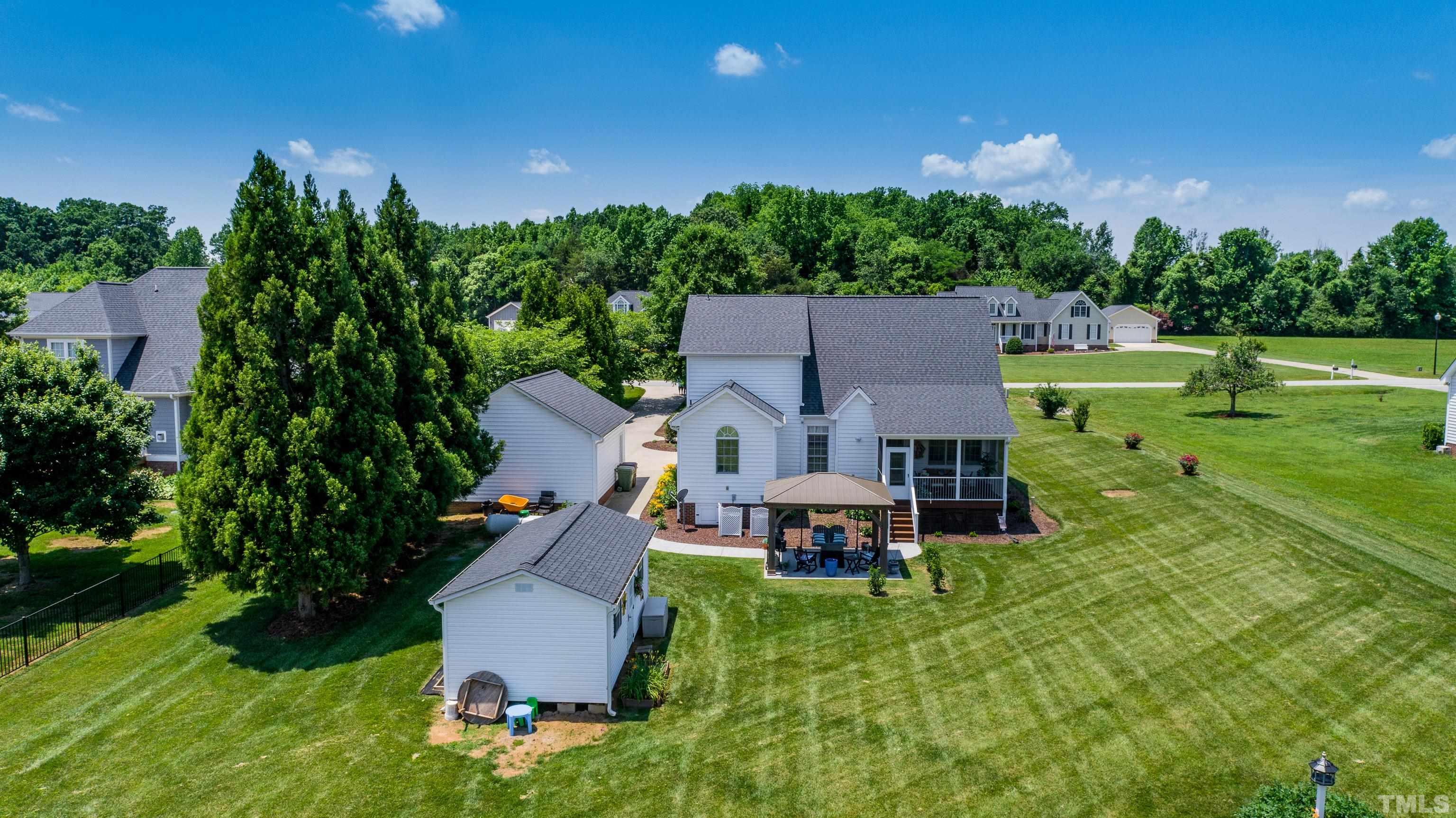103 Derwin Drive Timberlake, NC 27583 - Photo 18 of 57 an aerial view of a house with garden space and a view of a house