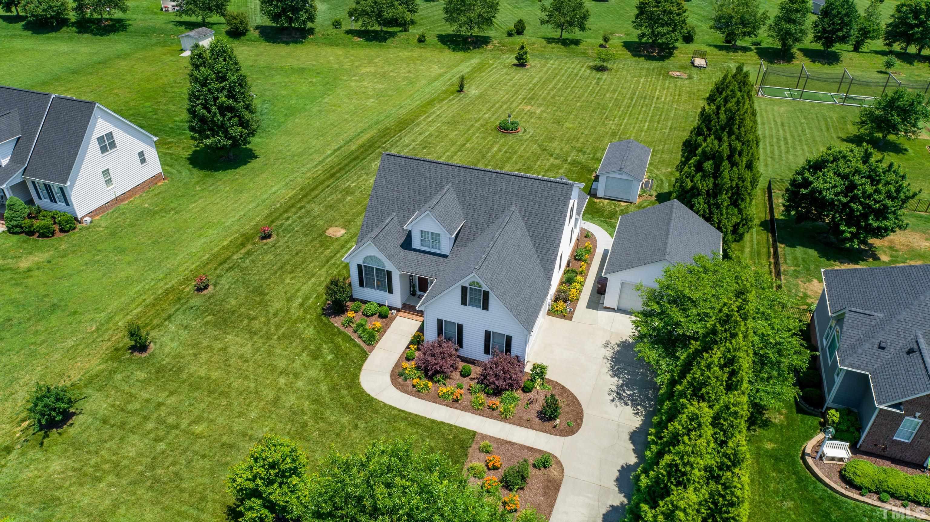 103 Derwin Drive Timberlake, NC 27583 - Photo 24 of 57 an aerial view of a house with yard swimming pool and outdoor seating