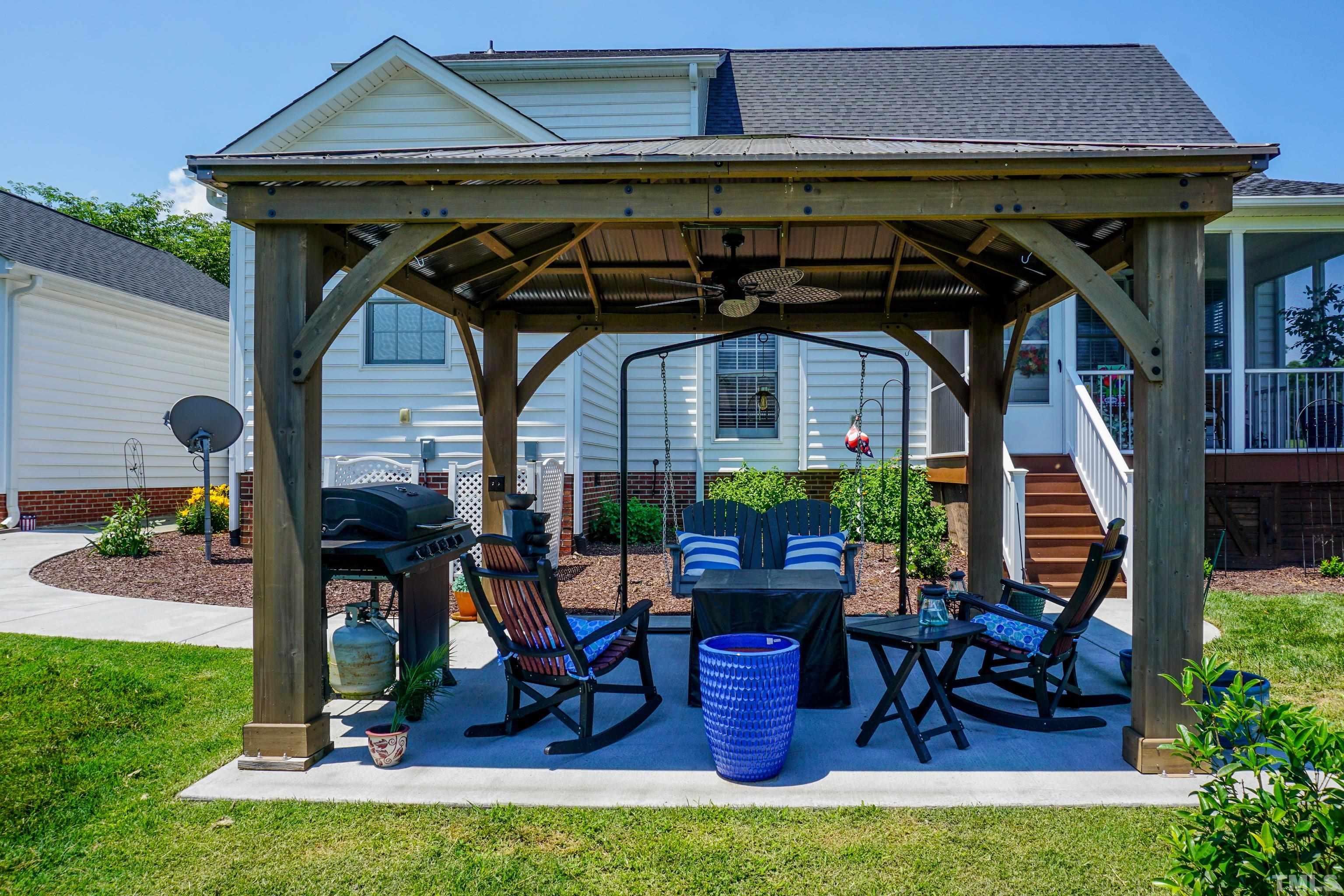 103 Derwin Drive Timberlake, NC 27583 - Photo 27 of 57 a view of wooden chairs and table in a patio