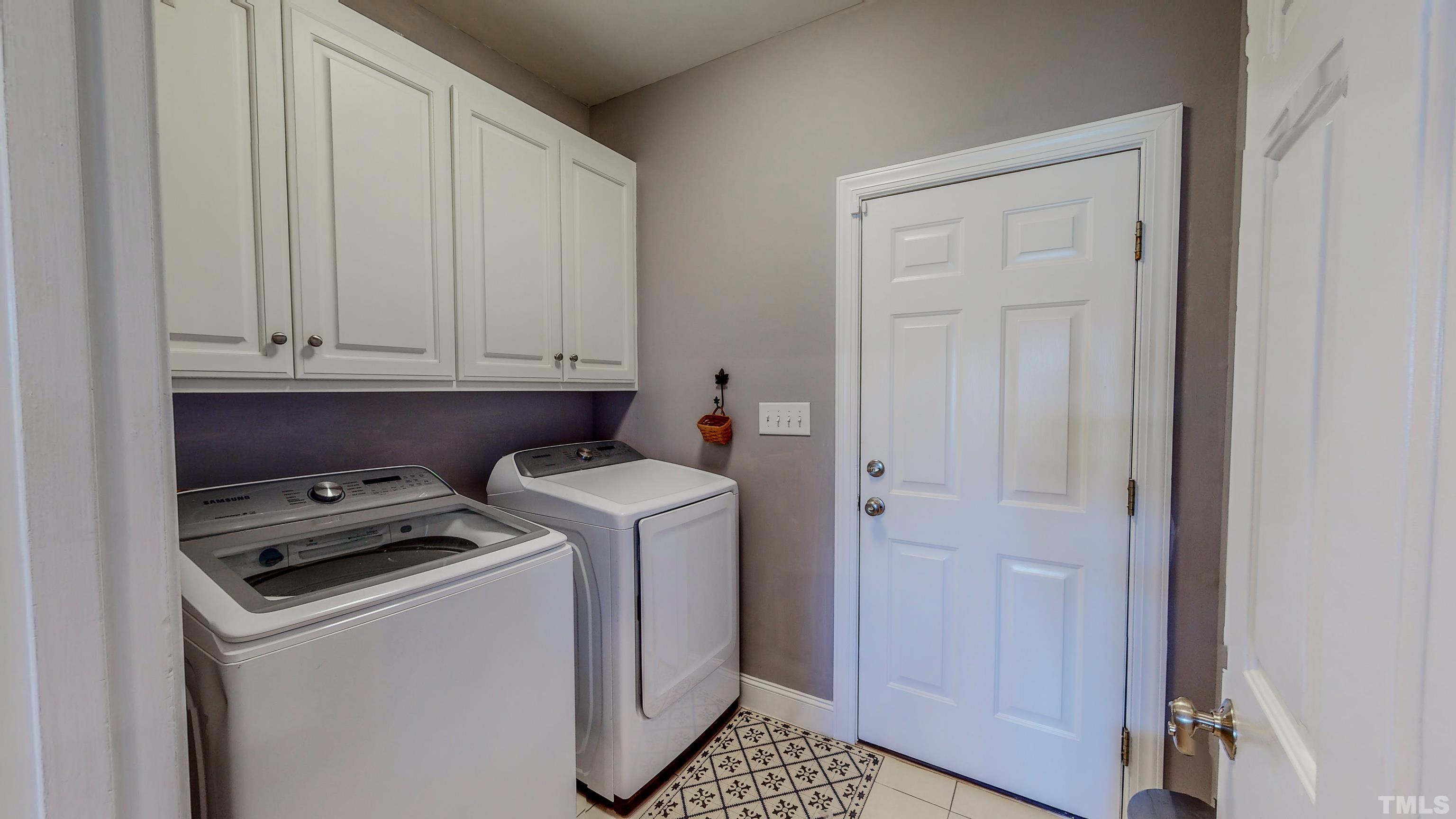103 Derwin Drive Timberlake, NC 27583 - Photo 29 of 57 a utility room with dryer and washer