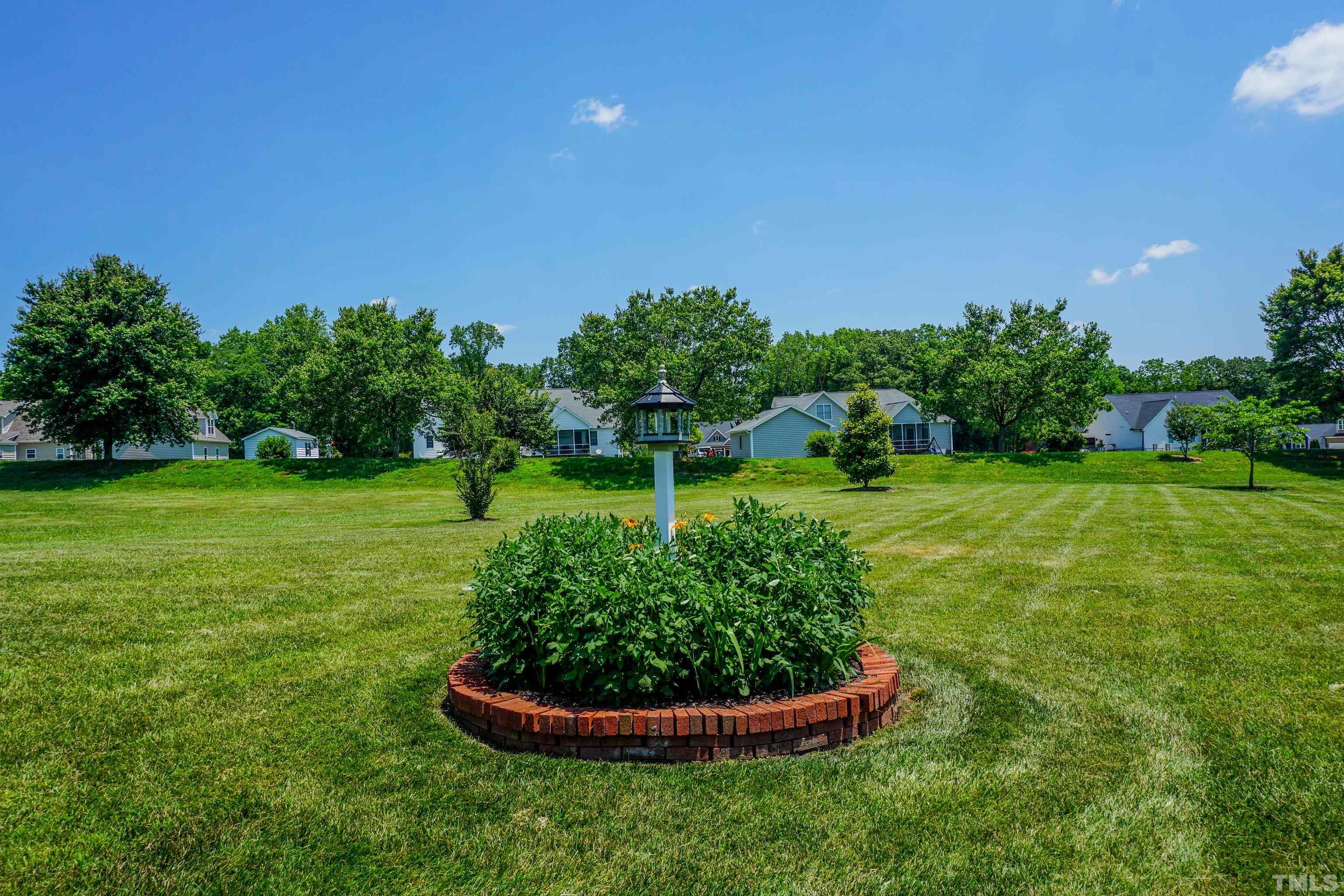 103 Derwin Drive Timberlake, NC 27583 - Photo 44 of 57 a garden with a small yard