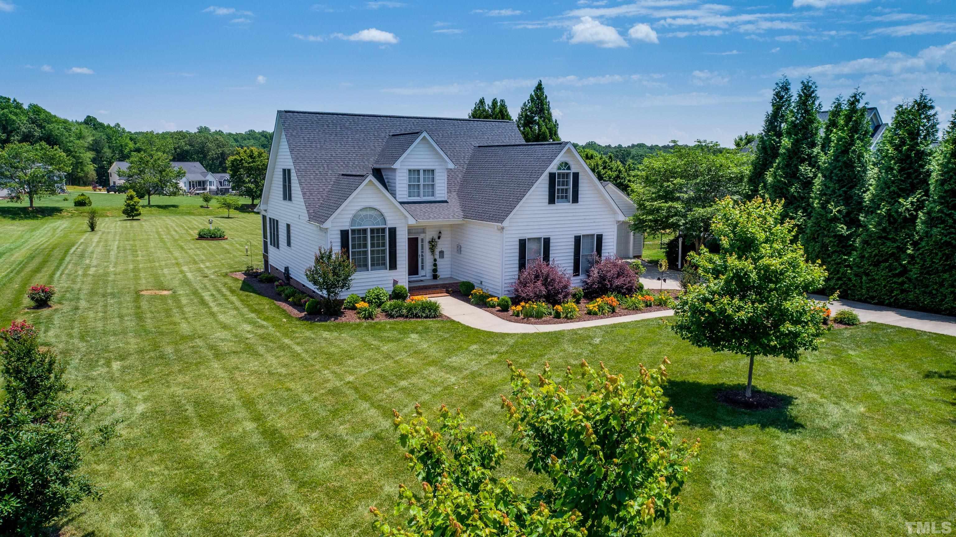 103 Derwin Drive Timberlake, NC 27583 - Photo 49 of 57 a view of a house with a big yard plants and large trees