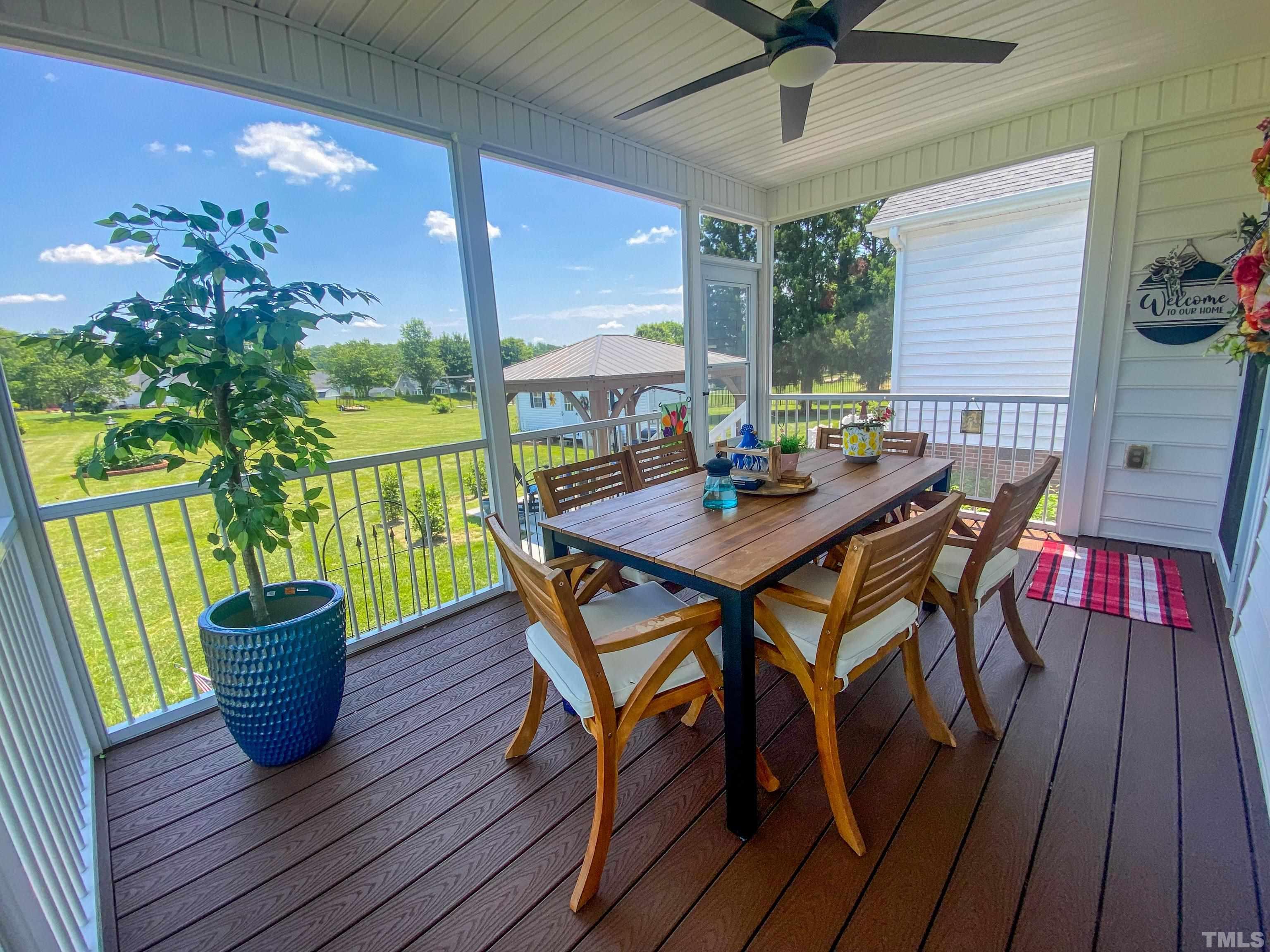 103 Derwin Drive Timberlake, NC 27583 - Photo 56 of 57 a view of a dining table and chairs on the roof deck