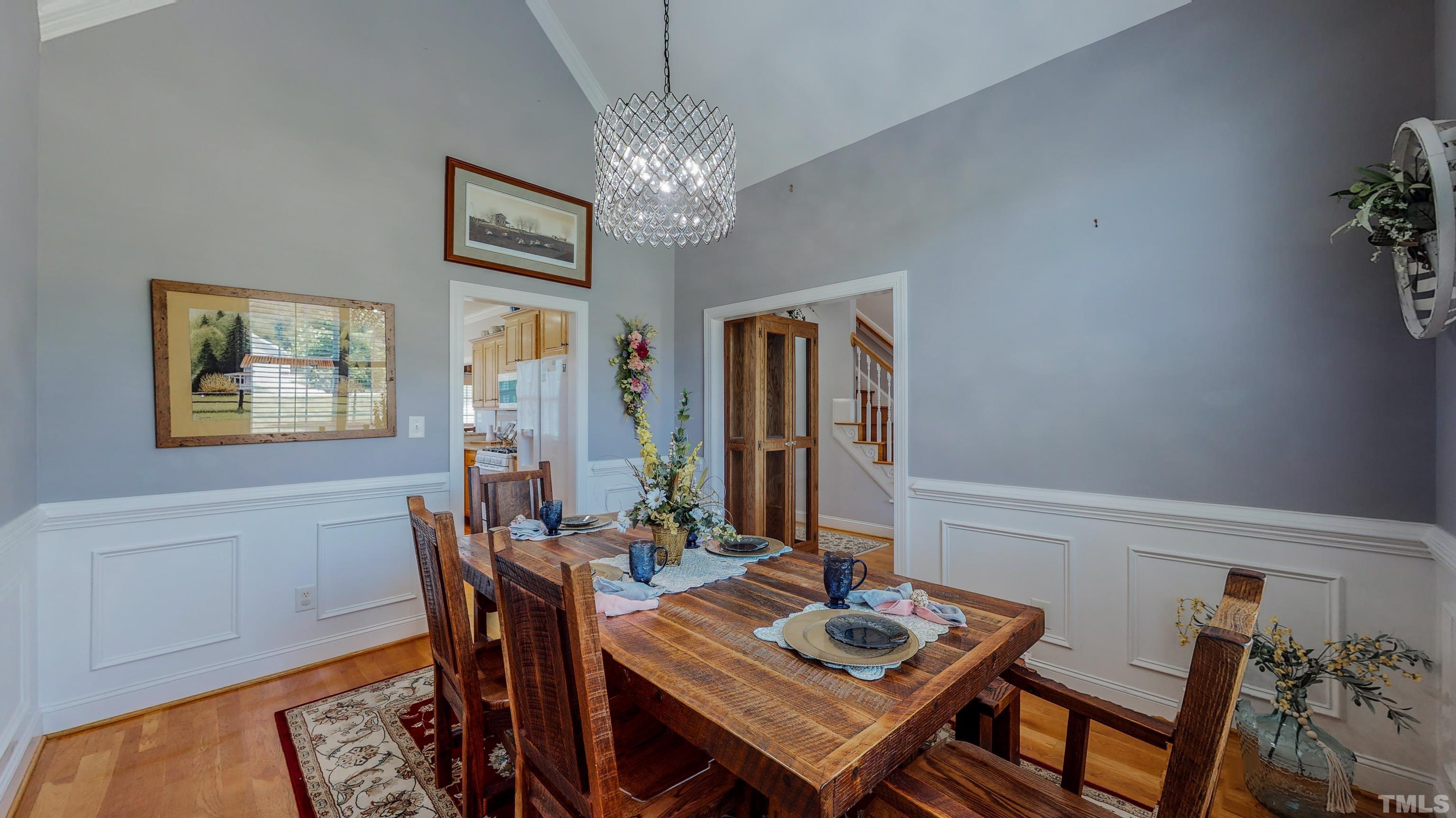 103 Derwin Drive Timberlake, NC 27583 - Photo 7 of 57 a view of a dining room with furniture and chandelier