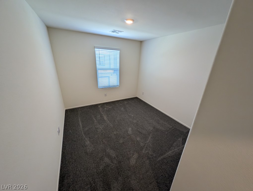 4820 Orchid Rdg Avenue Las Vegas, NV 89141 - Photo 25 of 27 A well-lit, quiet room features new carpeting and a single window, ready for personalization.