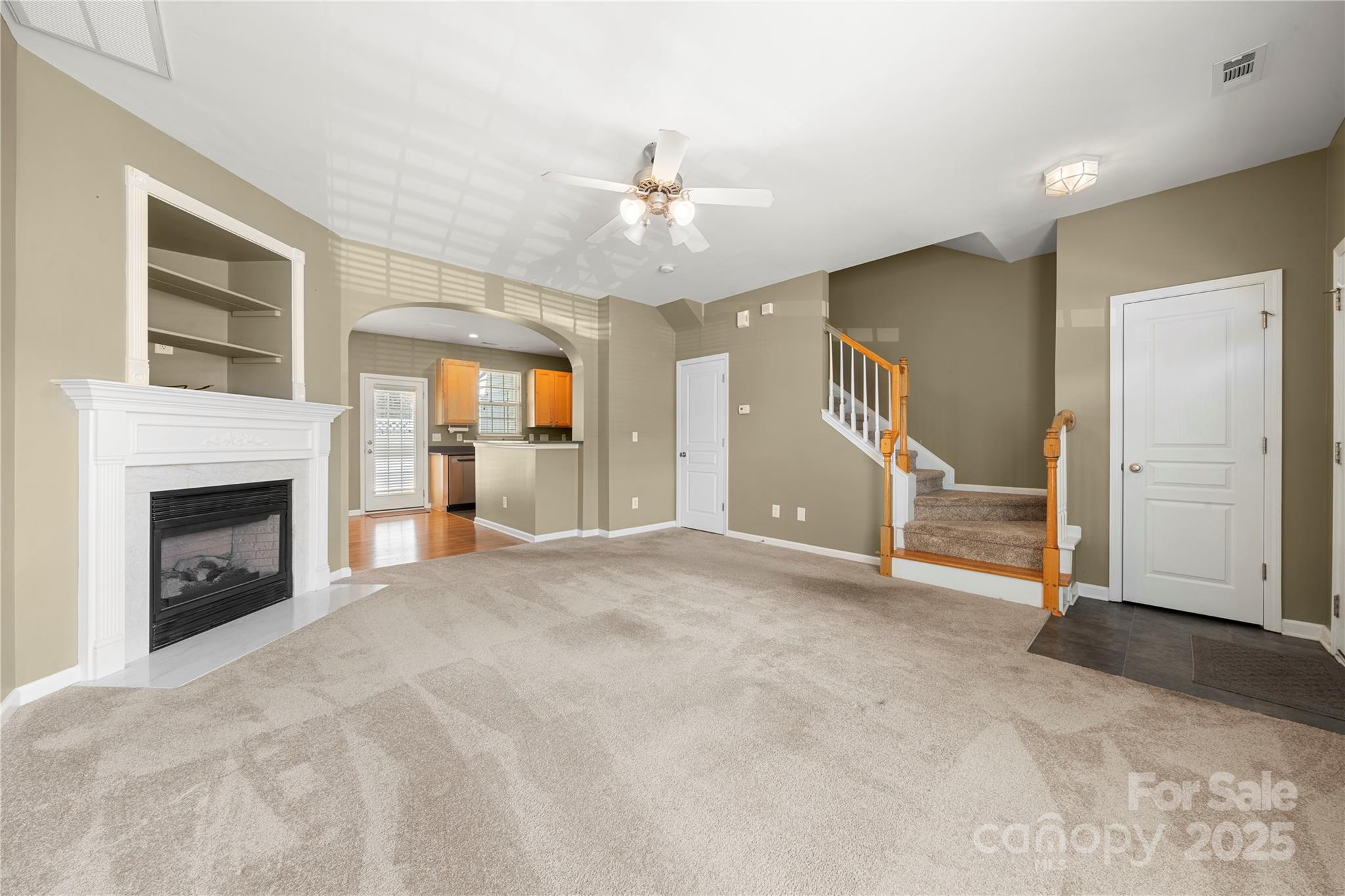 943 Copperstone Lane Fort Mill, SC 29708 - Photo 11 of 37 a view of an empty room with window and fireplace