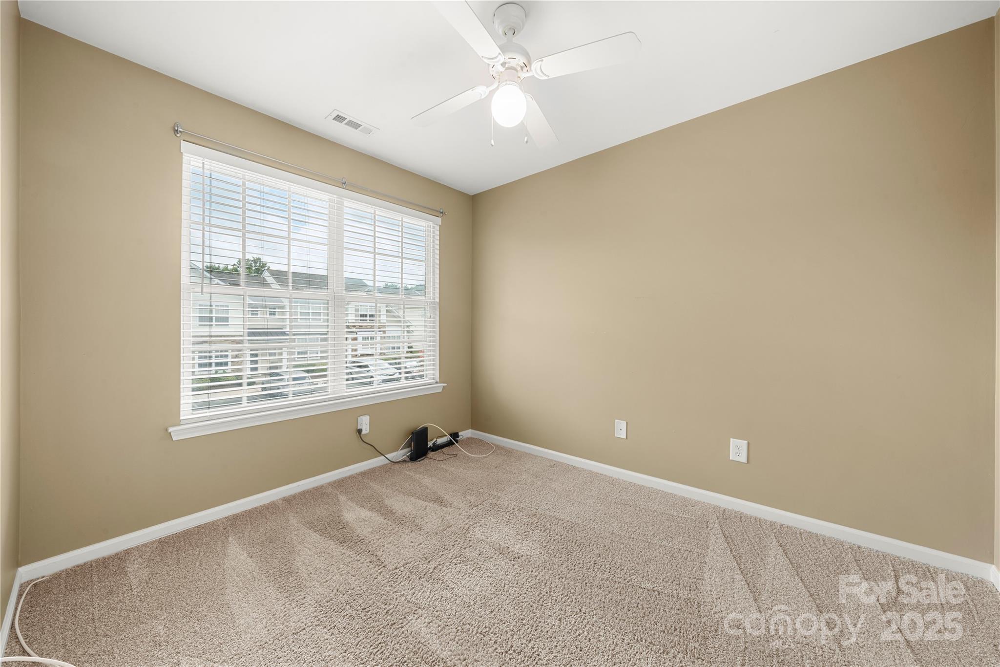 943 Copperstone Lane Fort Mill, SC 29708 - Photo 22 of 37 a view of an empty room with a window