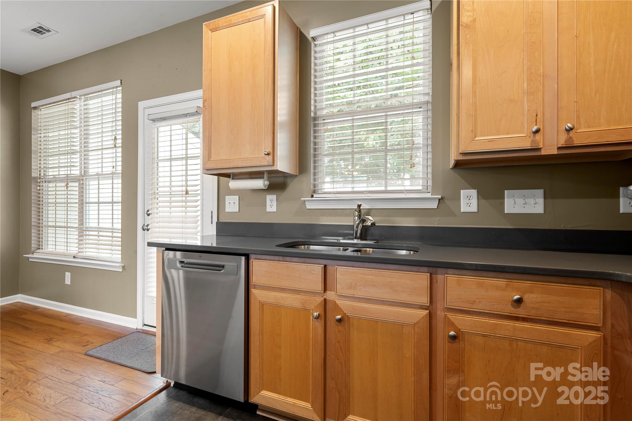 943 Copperstone Lane Fort Mill, SC 29708 - Photo 8 of 37 a kitchen with granite countertop white cabinets and a window