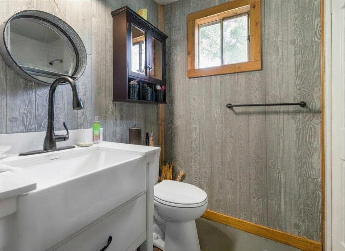 182 Smith Road Palacios, TX 77465 - Photo 14 of 23 a bathroom with a sink a toilet and mirror
