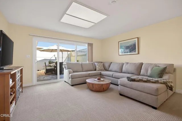 a view of a livingroom with furniture and window