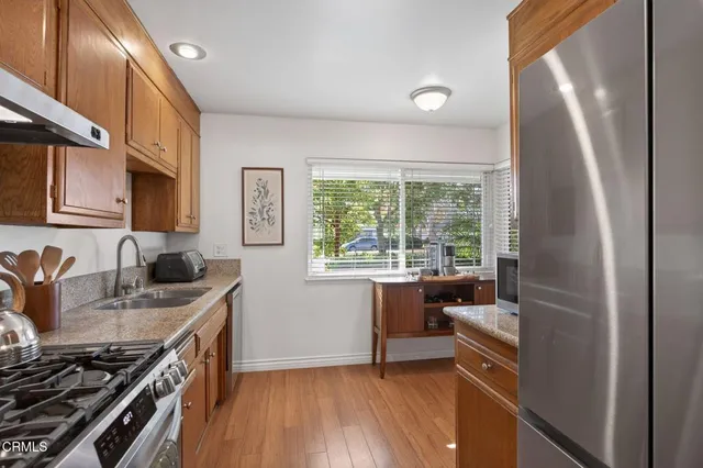 a living room with furniture a chandelier and a window