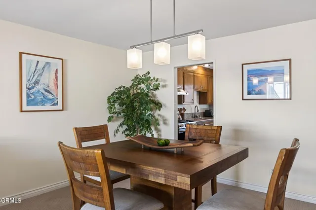 a bedroom with a bed and a dresser next to a window