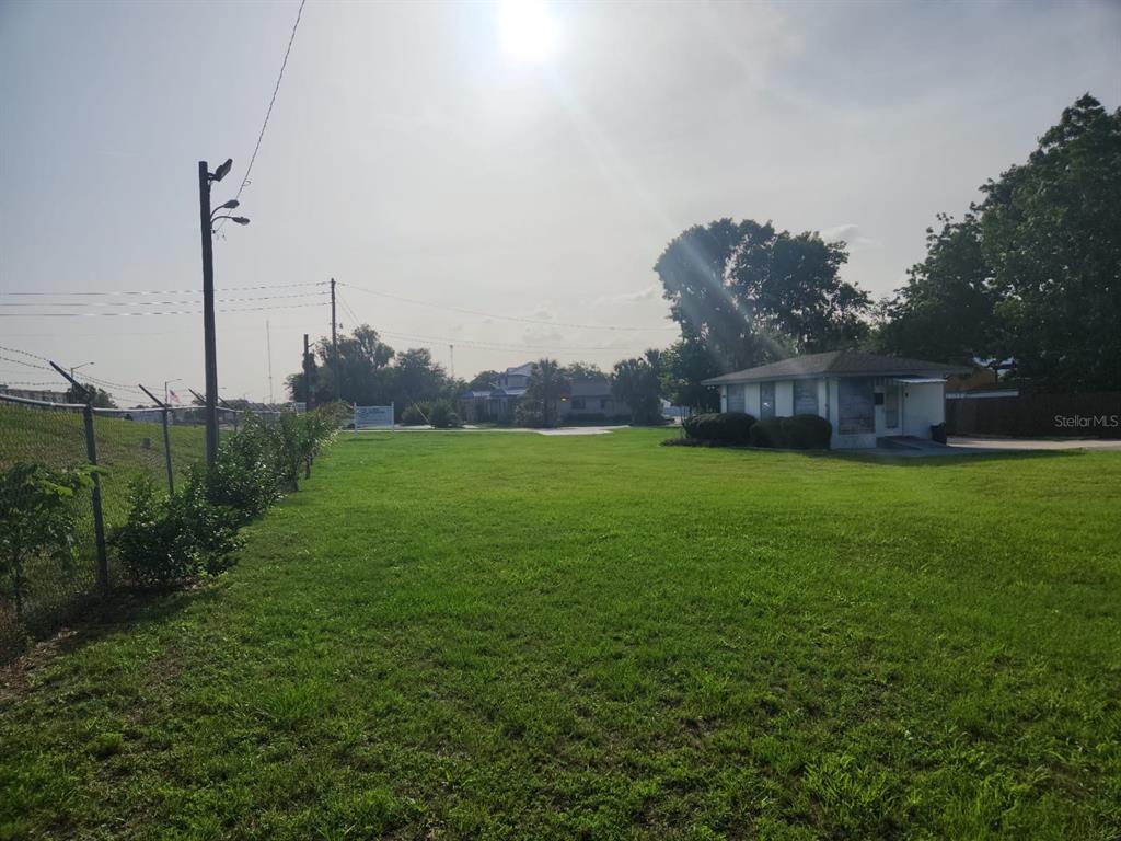 909 Southwest Sw Highway Ocala, FL 34471 - Photo 19 of 19 a backyard of a house with lots of green space and lake view