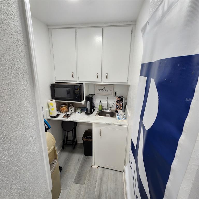 909 Southwest Sw Highway Ocala, FL 34471 - Photo 9 of 19 a room with a sink a washer and dryer